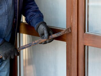 a-thief-trying-to-burden-a-window-door-with-the-cr-2024-09-12-13-00-57-utc