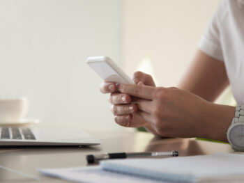 Businesswoman looking important contact on phone