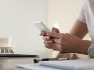 Businesswoman looking important contact on phone